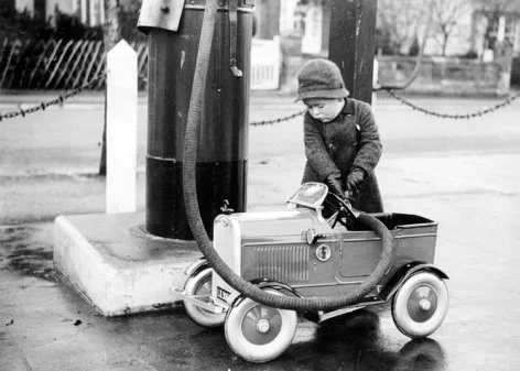 Little girl filling up car, Greeting Card