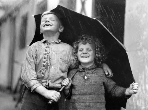 Children sharing an umbrella, Greeting Card