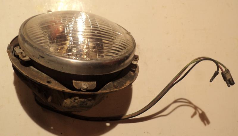 1957 Mercury      headlight pot  left