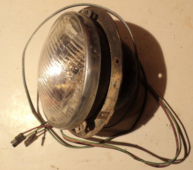 1957 Mercury      headlight pot  right