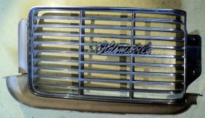 1969   Oldsmobile 88    grill half (the plastic cracked)      left