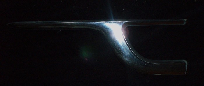 1955 Chrysler New Yorker chrome left rear (minor injury)