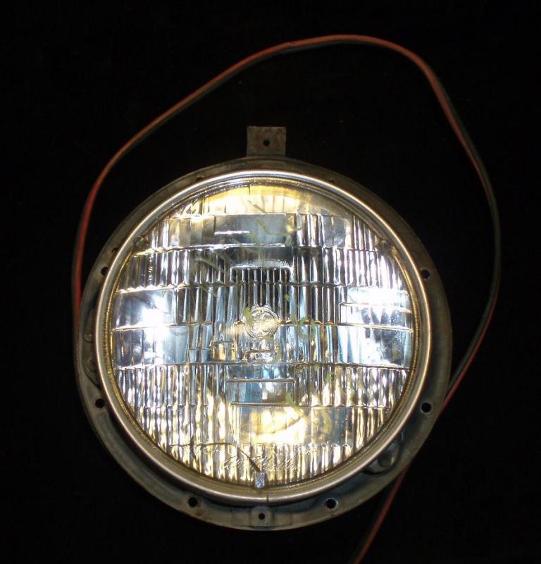 1956 Chrysler headlight pot left