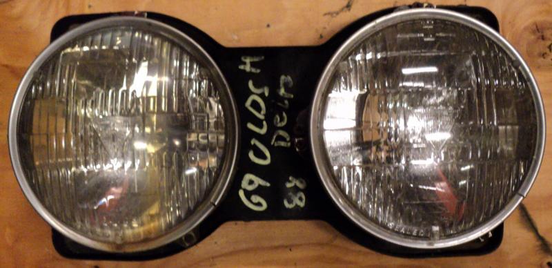 1969   Oldsmobile 88           headlight pot   right