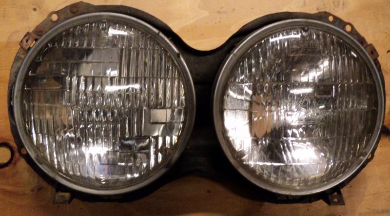 1963   Cadillac           headlight pot   left