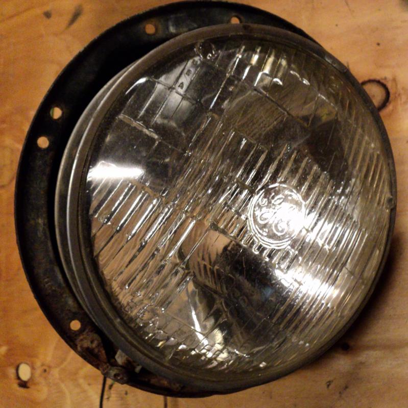 1955   Cadillac         headlight pot   right