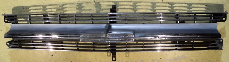 1964   Oldsmobile Jetstar   grill (some pores in emblem see picture)