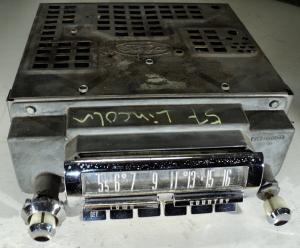 1957 Lincoln    radio (not tested, missing a button, pores in chrome)