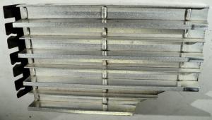 1963 Cadillac  grill part lower left