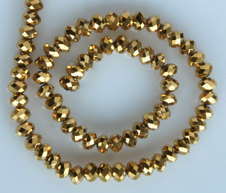 Glaspärlor facetterad rondell 6,5x4,5 mm. Guld, ca 65 st