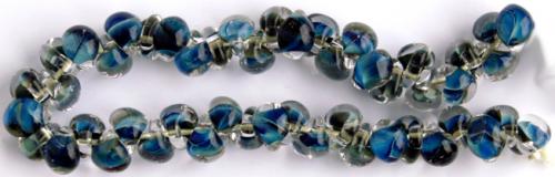 Glasdroppar i en "strand" om ca 25 st. Multiblå-svart