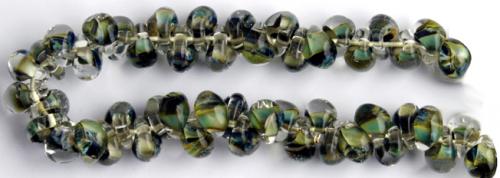 Glasdroppar i en "strand" om ca 25 st. Multigrön-brun