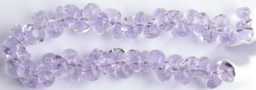 Glasdroppar i en "strand" om ca 25 st. Ljuslila