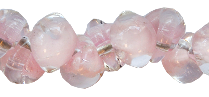 Glasdroppar i en "strand" om ca 25 st. Rosa-klar