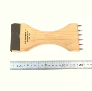 Sadelgjordsspännare i trä