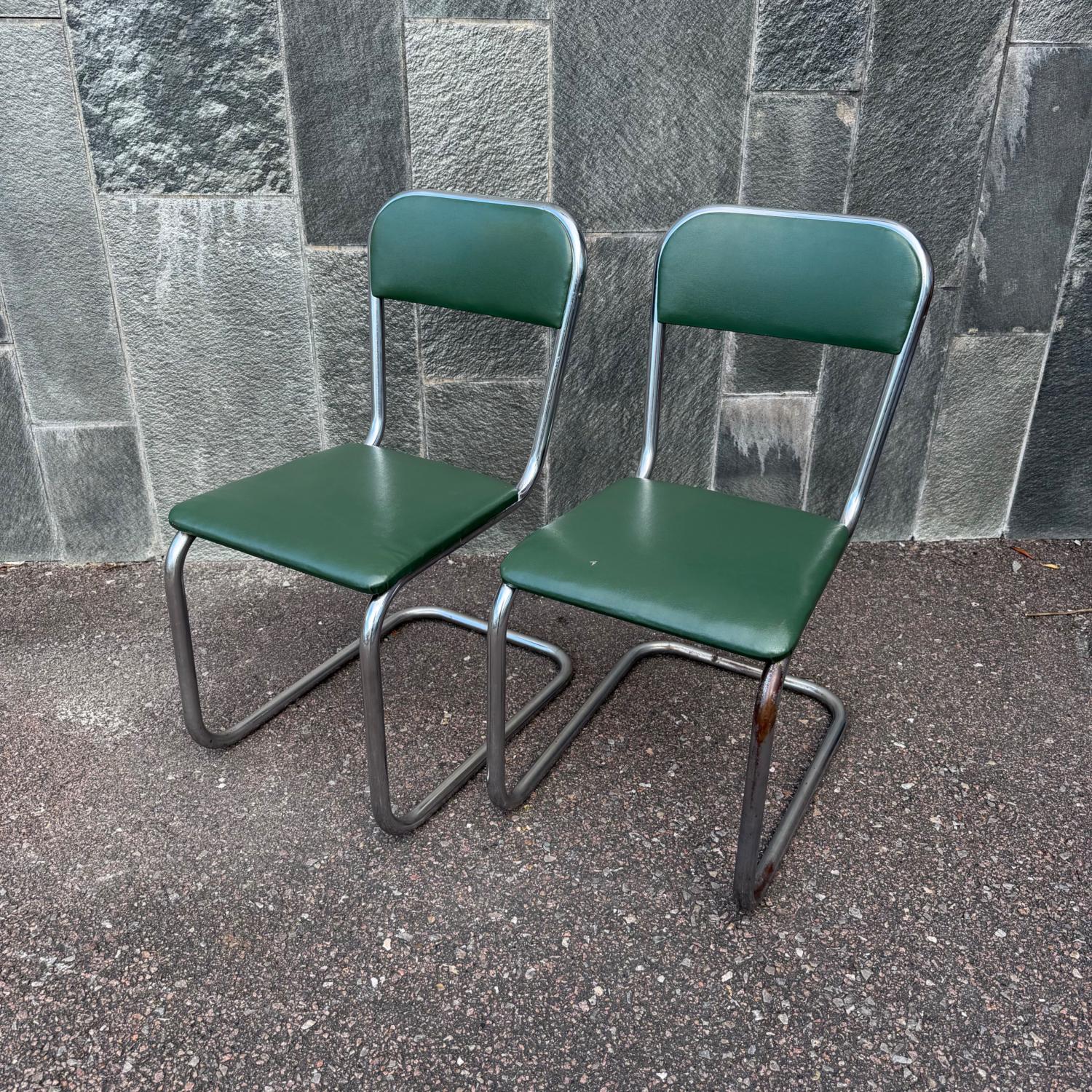 Ett par stålrörsstolar mörkgröna 1930-tals