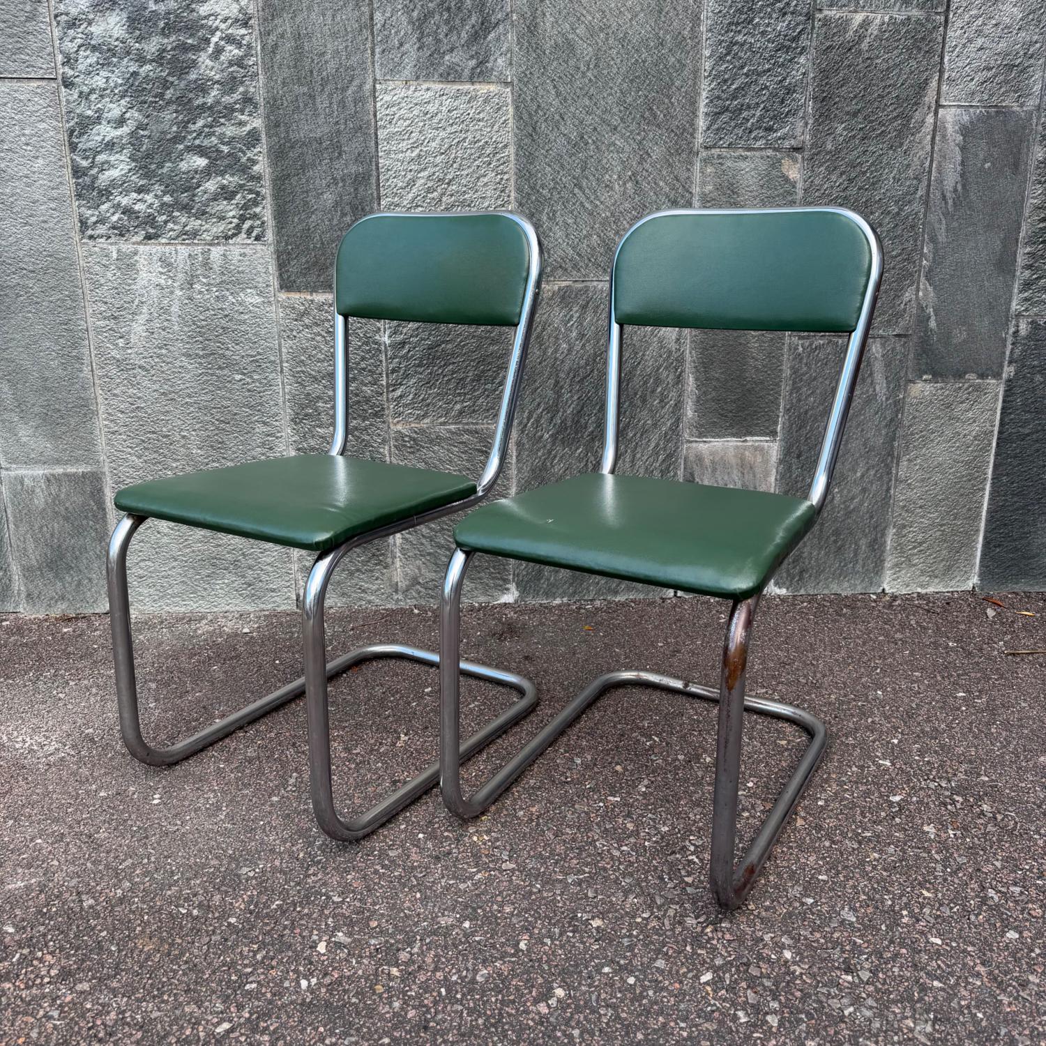 Ett par stålrörsstolar mörkgröna 1930-tals