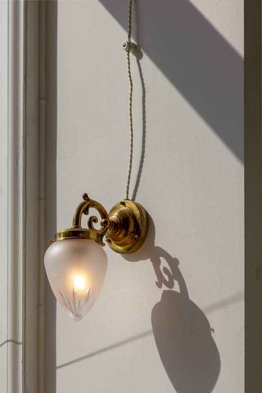 Porcelain insulators, intertwined cable and light fixtures - old style