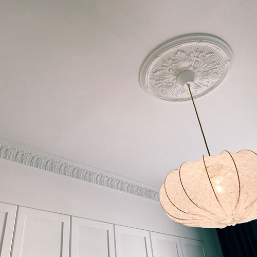 Beautiful ceiling rose in old style - old fashioned style - vintage interior - classic style - retro