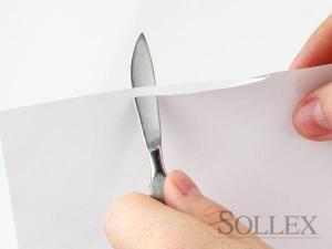 Scalpel cuts through a paper sheet