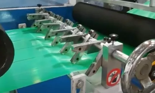 Tape cutting machine using industrial razor blades to slit at 45 degrees angle and convert adhesive tape - Sollex