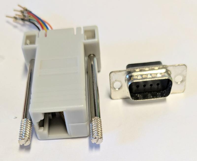 Adapter D-sub 9 pin, 8 stift , Han till RJ45 Hon Grå RS232
