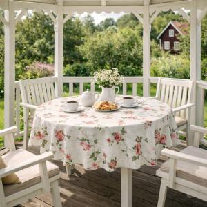 Rund Vaxduk BLOMSLINGA med slingrande gröna grenar med rosa rosor, beige bottenfärg