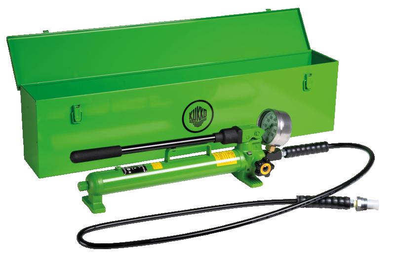 Handpump med slang, manometer, metallåda