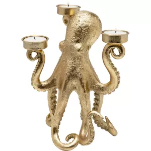 Skulptural ljusstake formad som en bläckfisk i guldton – liten i formatet men stor i uttryck.