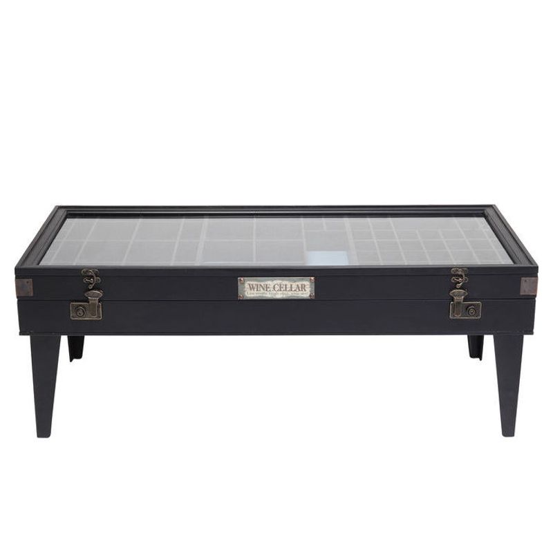 Ett rektangulärt svart soffbord i fin vintagestil.