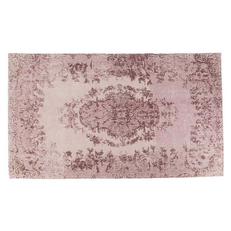 En fin matta med diskret mönster i nyanser av puder.