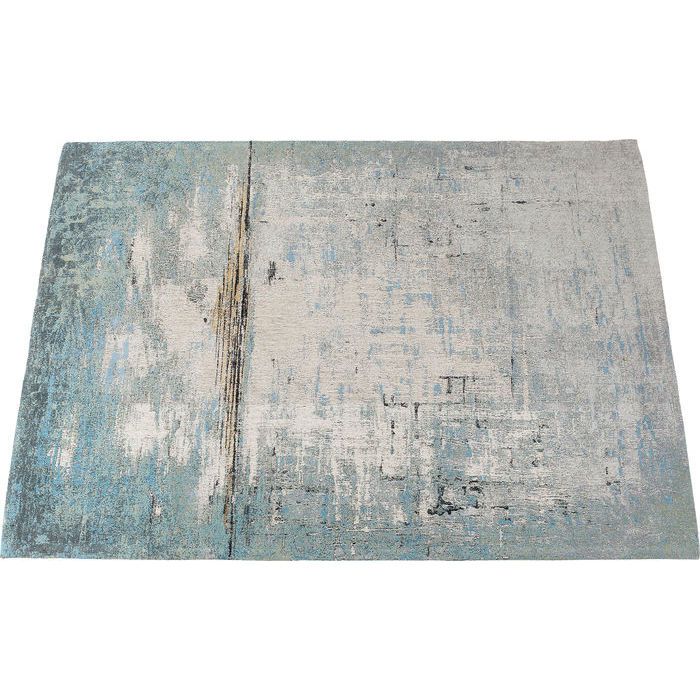 En vacker matta med abstrakt mönster i grå, blå och beige färgton från wohnzimmer.se
