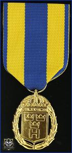 Hemvärnets tjänstgöringsmedalj i guld med parmonterad siffra för 20 tjänsteår